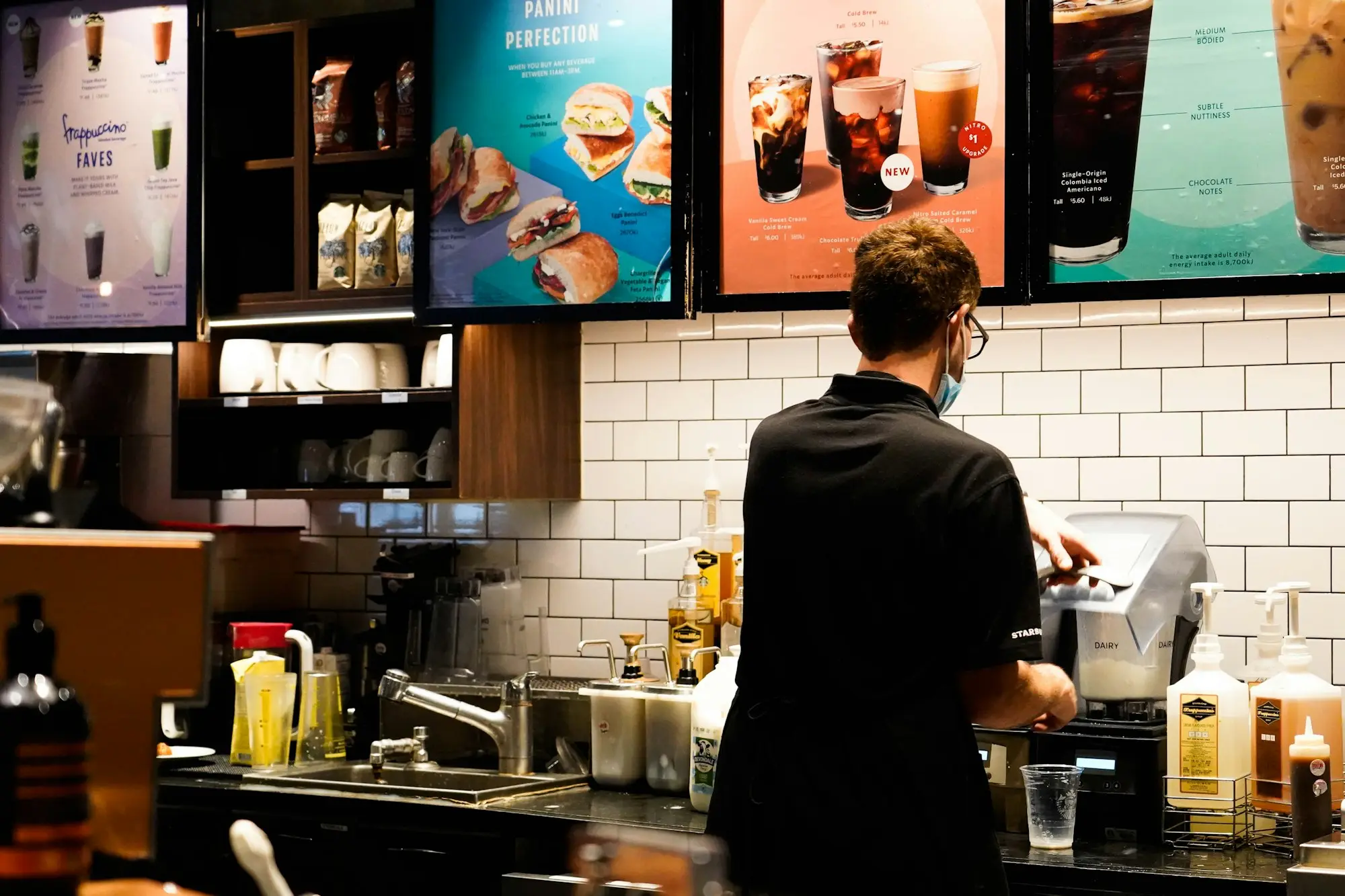 Café manager working at the counter