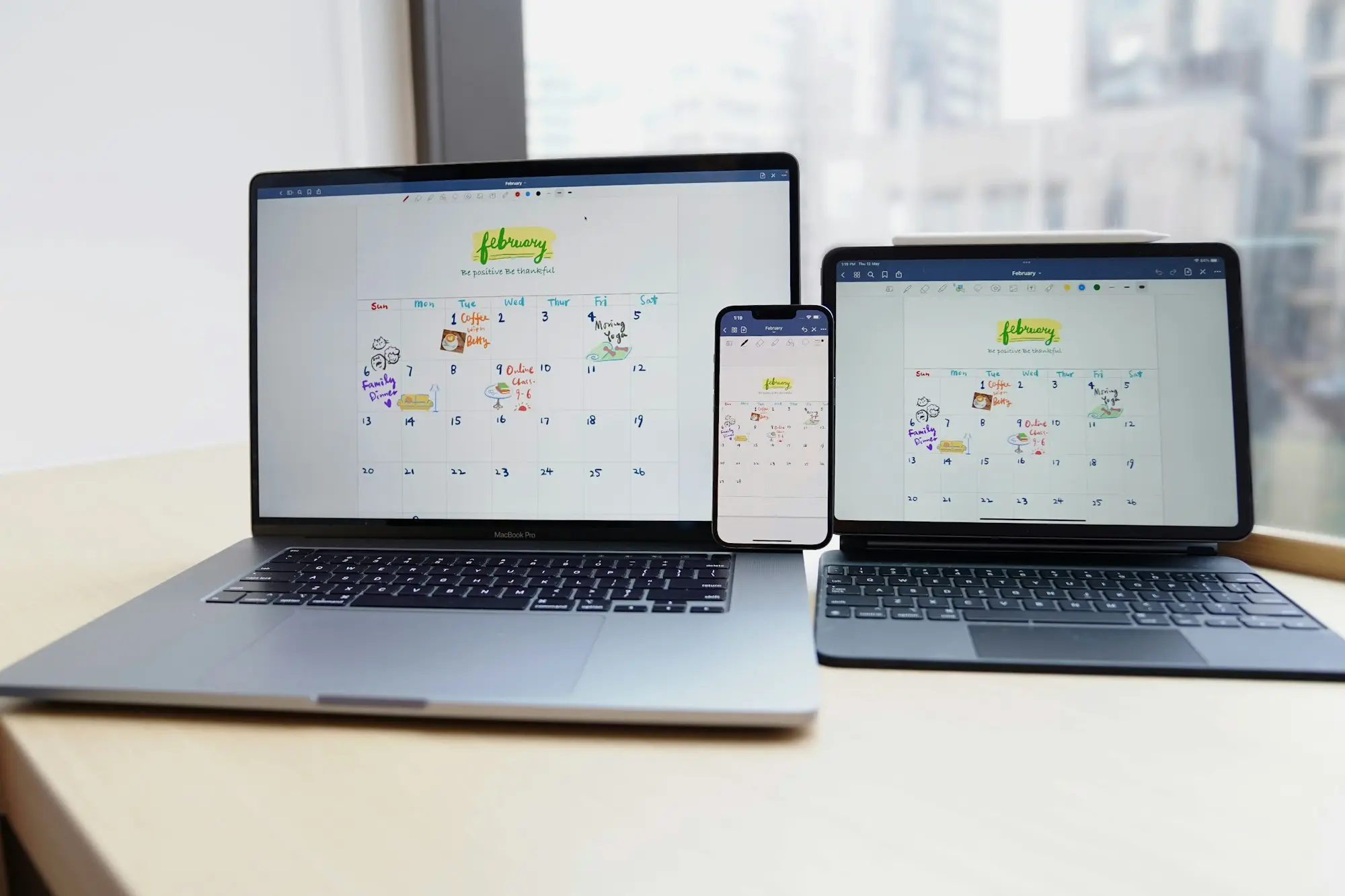 Laptops open on a planning desk